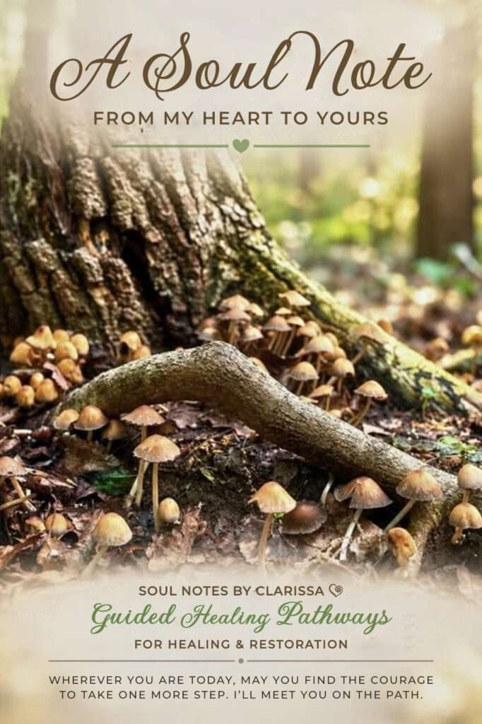 Clusters of small brown mushrooms growing among exposed tree roots and fallen leaves on a woodland floor.