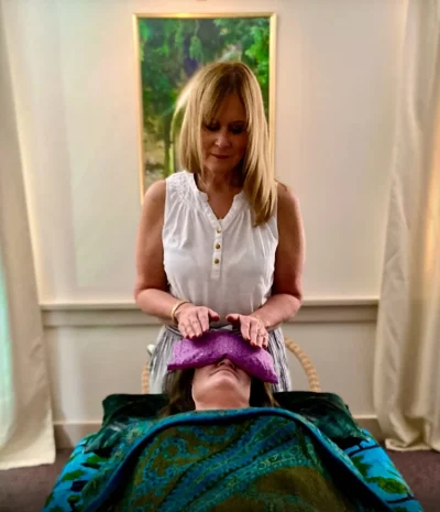 Clarissa Wrightson providing an energy healing session at Guided Healing Pathways